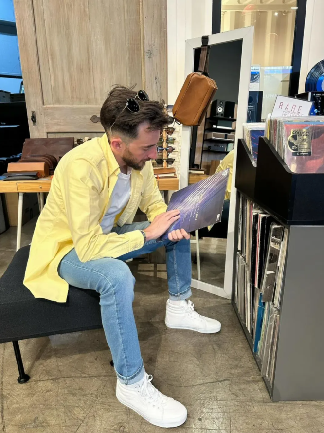 13uxz browsing vinyl at a record store